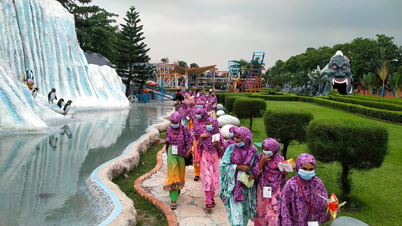 Orphans visiting theme park